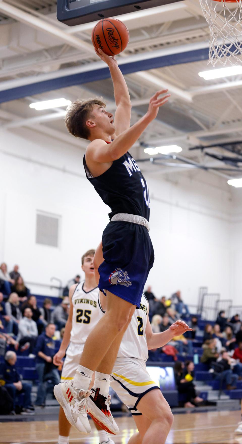 Mason's Luke Marlan puts up a layup against Haslett, Friday, Dec. 9, 2022, in Haslett. Mason won 63-36.