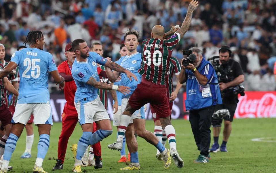 Players from both sides push each other around after full time