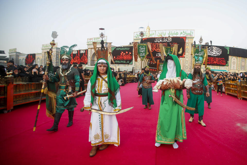 Iraqi Shiites take part in Ashura that marks the martyrdom of Husayn ibn Ali, a grandson of the Islamic prophet Muhammad, and members of his immediate family in the Battle of Karbala, in Karbala, Iraq, Monday, Aug. 8, 2022. (AP Photo/Anmar Khalil)