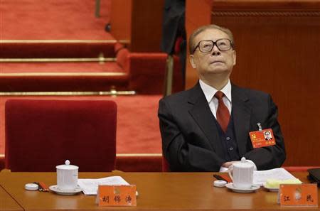 China's former President Jiang Zemin looks up while President Hu Jintao gives his speech during the opening ceremony of 18th National Congress of the Communist Party of China at the Great Hall of the People in Beijing, November 8, 2012. REUTERS/Jason Lee