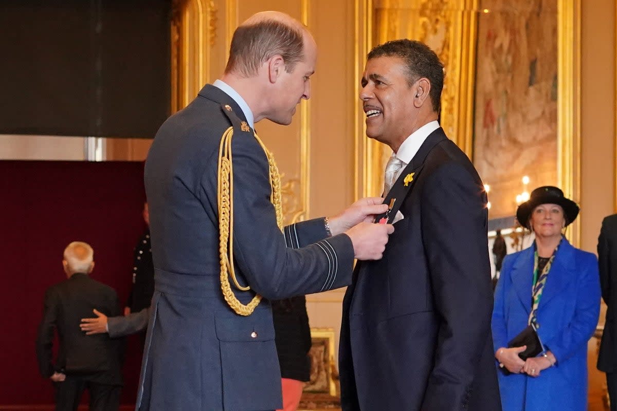 Chris Kamara receives his MBE (Jonathan Brady/PA) (PA Wire)