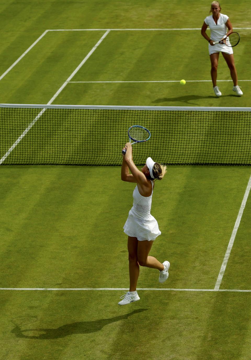 Maria Sharapova of Russia hits a shot during her match against Richel Hogenkamp of the Netherlands at the Wimbledon Tennis Championships in London, July 1, 2015. REUTERS/Henry Browne