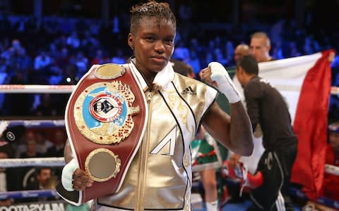 Nicola Adams poses with her belt after a split decision in her WBO World Flyweight Championship bout against Maria Salinas - Credit: pa