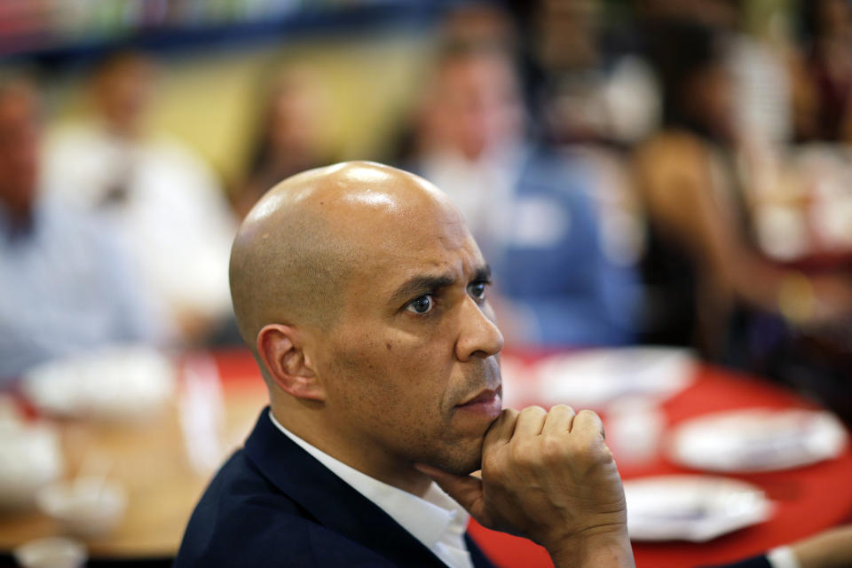 FILE - In this April 20, 2019 photo, Democratic presidential candidate Sen. Cory Booker listens during a campaign event at a restaurant in Las Vegas. Booker rose to fame as a New Jersey mayor and senator but his mom and other relatives have lived in Las Vegas for years. Now, he’s working those local connections to set himself apart from the crowded pack in a state that could be decisive. (AP Photo/John Locher, File)