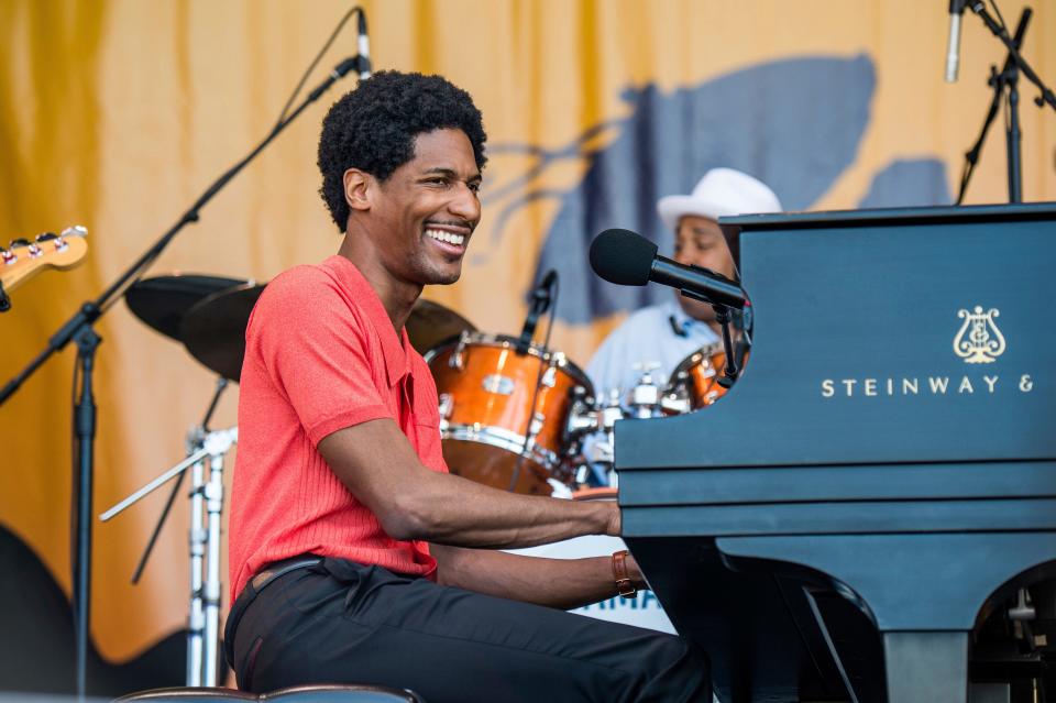 Jon Batiste performs during the Tribute to Fats Domino at the New Orleans Jazz and Heritage Festival in 2018.