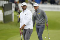 Dustin Johnson of the United States stands on the practice green before the first round of the inaugural LIV Golf Invitational at the Centurion Club in St. Albans, England, Thursday, June 9, 2022. The first LIV Golf Invitational, which offers $25 million in prize money, is taking place outside London starting Thursday. (AP Photo/Alastair Grant)