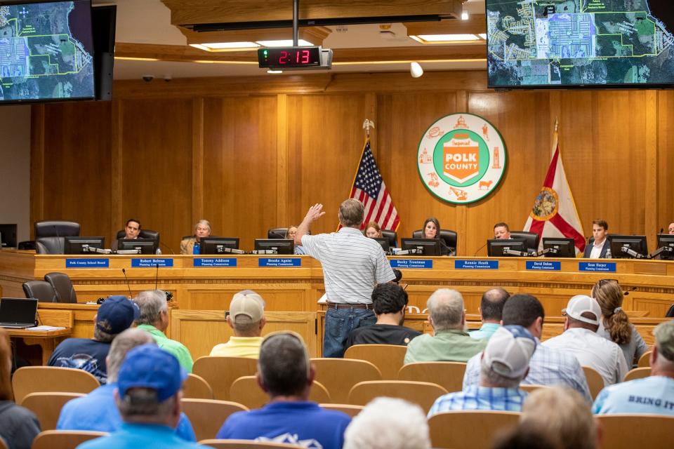 Residents protest a proposed housing development off Hatchineha Road during a Polk Planning Commission hearing to deliberate on the fate of 1,876 homes for the Creek Ranch development in the County Commission chamber in Bartow Fl. Tuesday August 2,2023.Ernst Peters/The Ledger