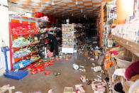 <p>Goods lie on the ground in a market shop following an earthquake in the town of Darbandikhan, near the city of Sulaimaniyah, in the semi-autonomous Kurdistan region, Iraq on Nov. 13, 2017. (Photo: Ako Rasheed/Reuters) </p>