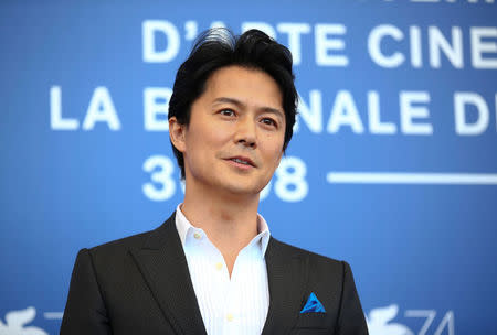 Actor Masaharu Fukuyama poses during a photocall for the movie "The third murder" at the 74th Venice Film Festival in Venice, Italy September 5, 2017. REUTERS/Alessandro Bianchi