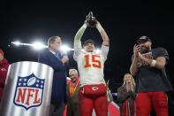 Kansas City Chiefs quarterback Patrick Mahomes (15) holds up the Lamar Hunt Trophy next to Kansas City Chiefs tight end Travis Kelce (87) after the AFC Championship NFL football game against the Baltimore Ravens, Sunday, Jan. 28, 2024, in Baltimore. The Chiefs won 17-10. (AP Photo/Matt Slocum)