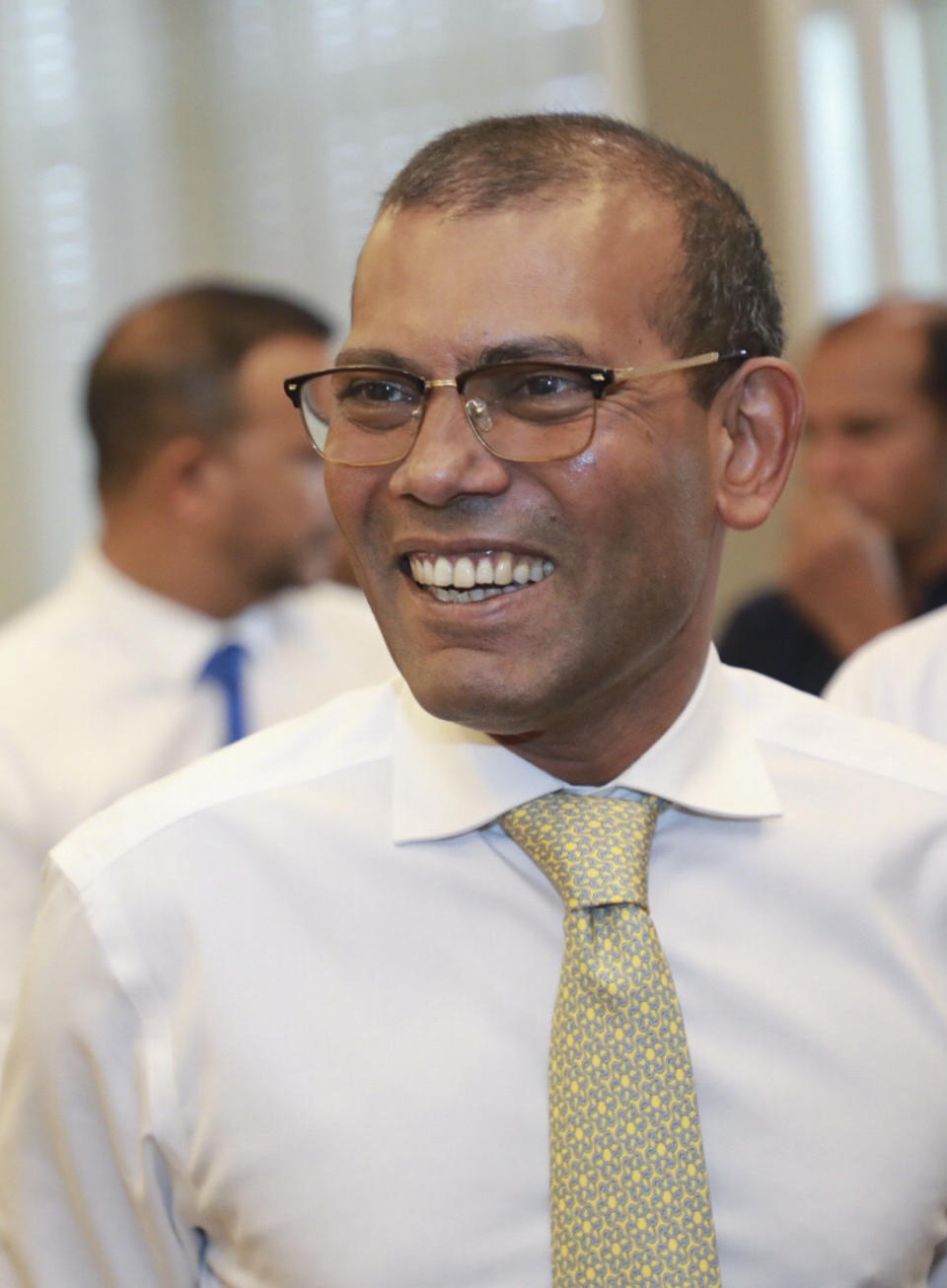 Maldives’ former president Mohamed Nasheed, gestures after his arrival at airport i, Maldives, Thursday, Nov.1, 2018. Nasheed, the first democratically elected president of the Maldives returned home Thursday after more than two years in exile to escape a long prison term. (AP Photo/Mohamed Sharuhaan)