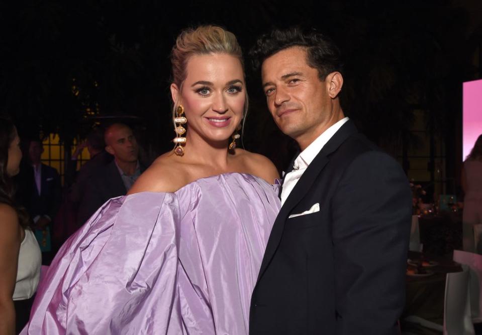 Katy Perry wows in lilac strapless ballgown next to husband Orlando Bloom