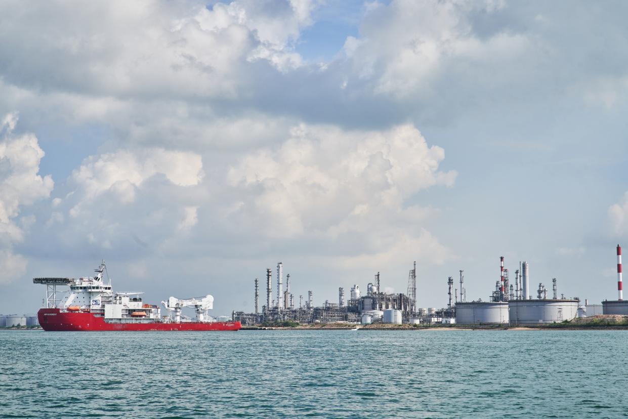 Oil Refineries and storage tanks standing at the Shell Eastern Petrochemicals Complex (SEPC) on Pulau Bukom are seen from a boat off the coast of Singapore, on Tuesday, May 25, 2020. Tuesday. Photographer: Lauryn Ishak/Bloomberg