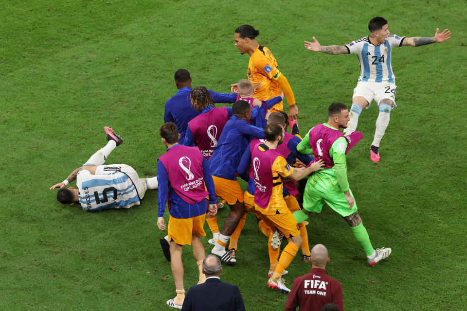 LUSAIL CITY, QATAR - DECEMBER 09: Virgil Van Dijk of Netherlands clashes with Leandro Paredes of Argentina during the FIFA World Cup Qatar 2022 quarter final match between Netherlands and Argentina at Lusail Stadium on December 09, 2022 in Lusail City, Qatar. (Photo by Alexander Hassenstein/Getty Images)