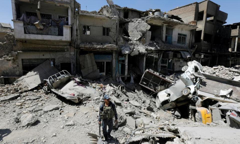 A member of the Iraqi federal police on patrol in the ruins of Mosul’s Old City