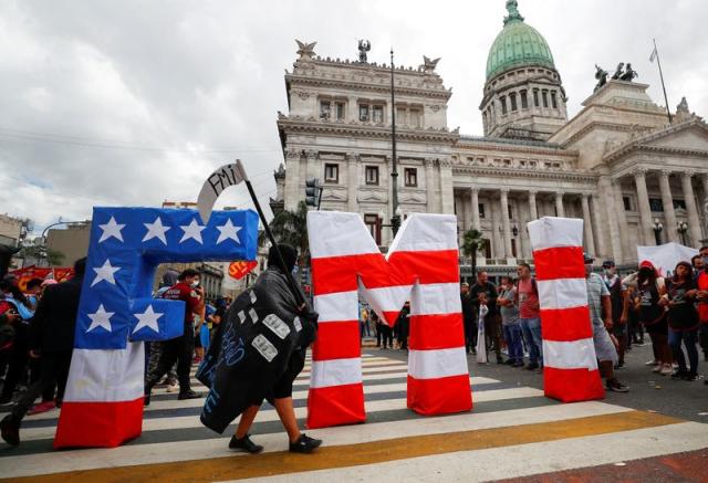 FILE PHOTO: Demonstrators protest against government's agreement with the IMF, in Buenos Aires