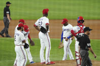 Texas Rangers starting pitcher Taylor Hearn (52) stands on the mound as he awaits a visit from manager Chris Woodward in the first inning against the Oakland Athletics in a baseball game Tuesday, June 22, 2021, in Arlington, Texas. (AP Photo/Louis DeLuca)