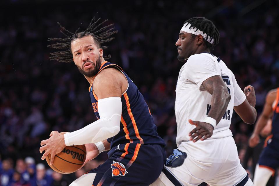 Feb 6, 2024; New York, New York, USA; New York Knicks guard Jalen Brunson (11) dribbles against Memphis Grizzlies forward Vince Williams Jr. (5) during the first half at Madison Square Garden. Mandatory Credit: Vincent Carchietta-USA TODAY Sports