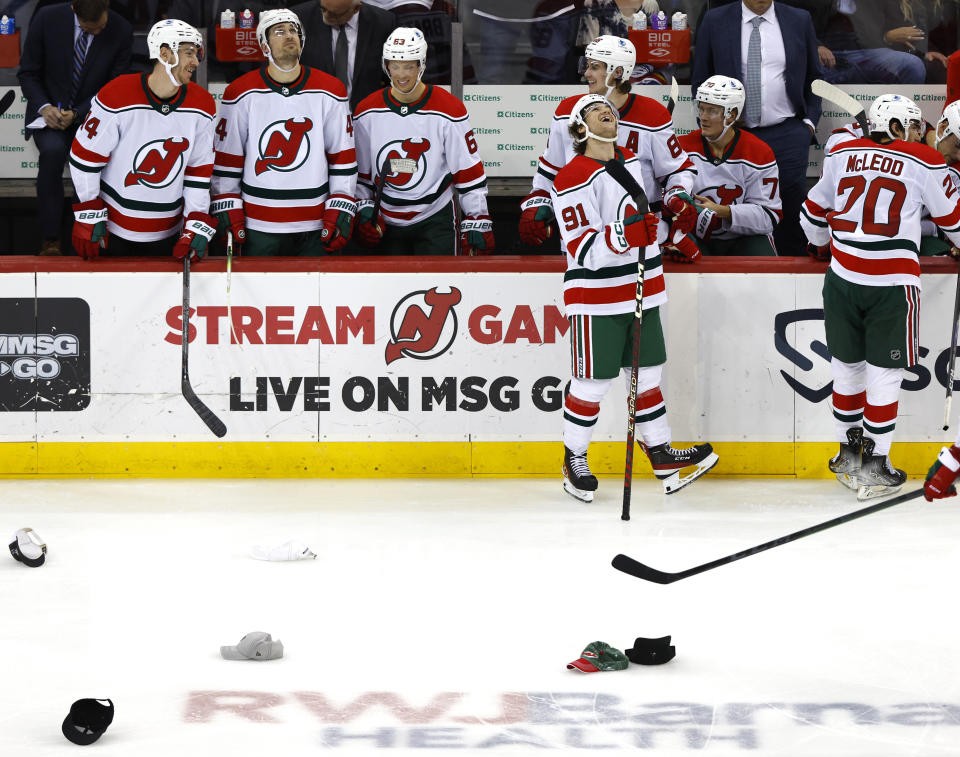 New Jersey Devils center Dawson Mercer (91) reacts after scoring his third goal of the game against the Pittsburgh Penguins during the third period of an NHL hockey game Tuesday, April 4, 2023, in Newark, N.J. The New Jersey Devils won 5-1. (AP Photo/Noah K. Murray)