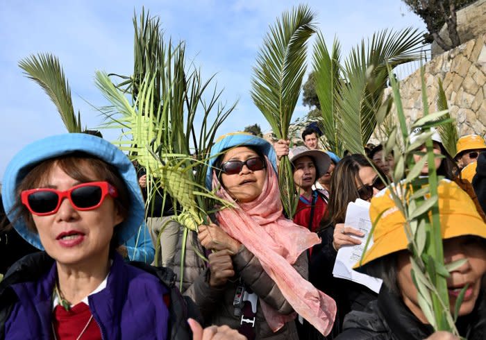 Christians walk in Palm Sunday procession in Jerusalem