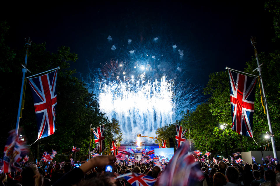 The crowds enjoy the fireworks over Buckingham Palace during the finale of the Diamond Jubilee Buckingham Palace Concert on June 4, 2012 in London, England. For only the second time in it's history, the UK celebrates the Diamond Jubilee of a monarch. Her Majesty Queen Elizabeth II celebrates the 60th anniversary of her ascension to the throne. (Photo by Ian Gavan/Getty Images)