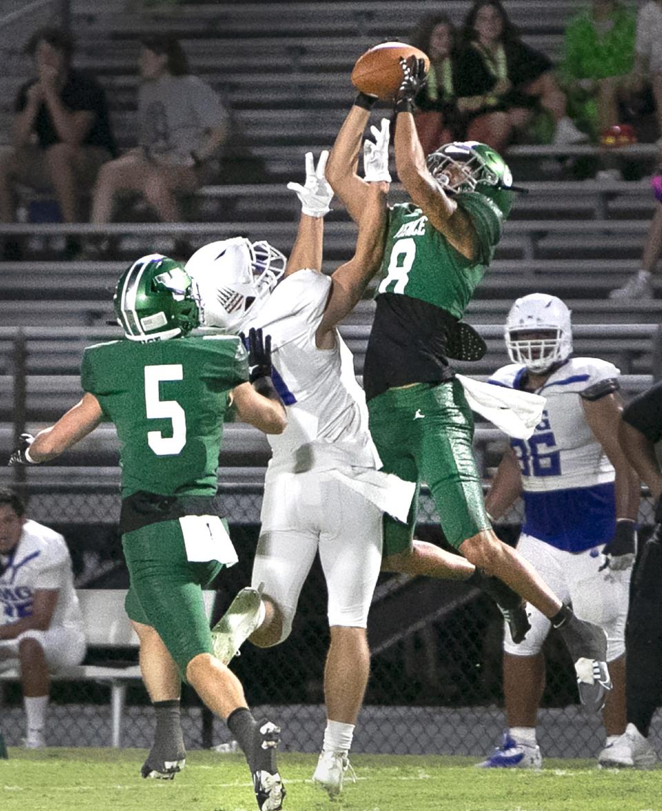 Venice cornerback Deylen Platt (8) tries for an interception against IMG Academy wide receiver Jacob Diver (7) during the Oct. 28, 2022, matchup in Venice.