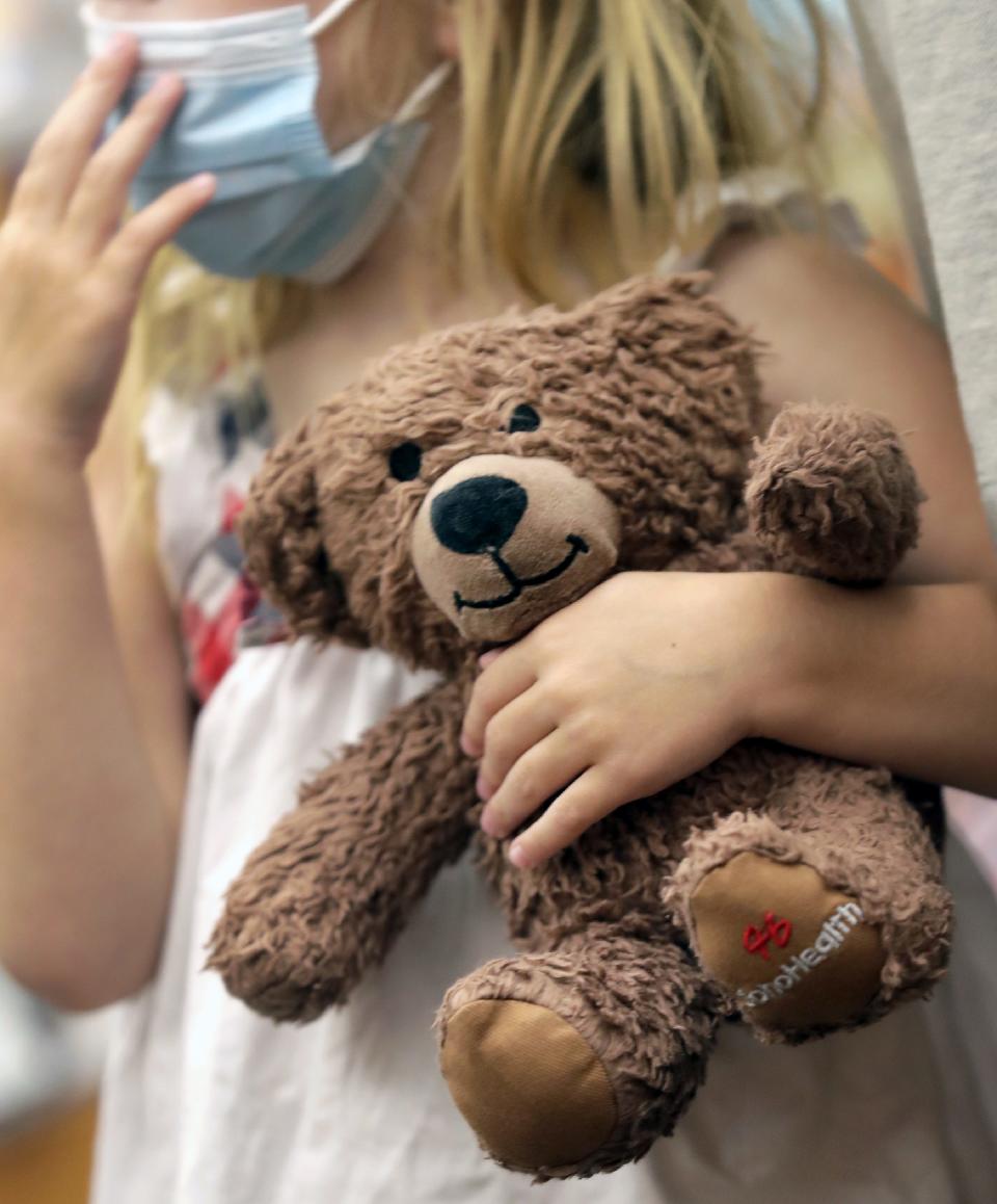 Children ages 6 months and up received a Teddy bear after they were vaccinated against COVID-19 at the Multicultural Coalition, Inc.'s vaccination clinic on  June 28 at the Neenah Public Library in Neenah.