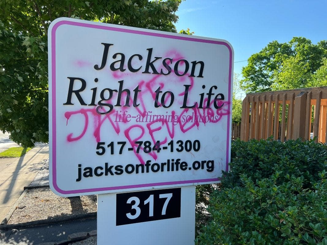 Graffiti reading "Jane' Revenge" is pictured on a sign at Jackson Right to Life's office in Jackson is pictured.