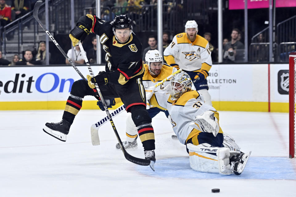 Vegas Golden Knights center William Karlsson (71) shoots against Nashville Predators goaltender Kevin Lankinen (32) during the second period of an NHL hockey game Saturday, Dec. 31, 2022, in Las Vegas. (AP Photo/David Becker)