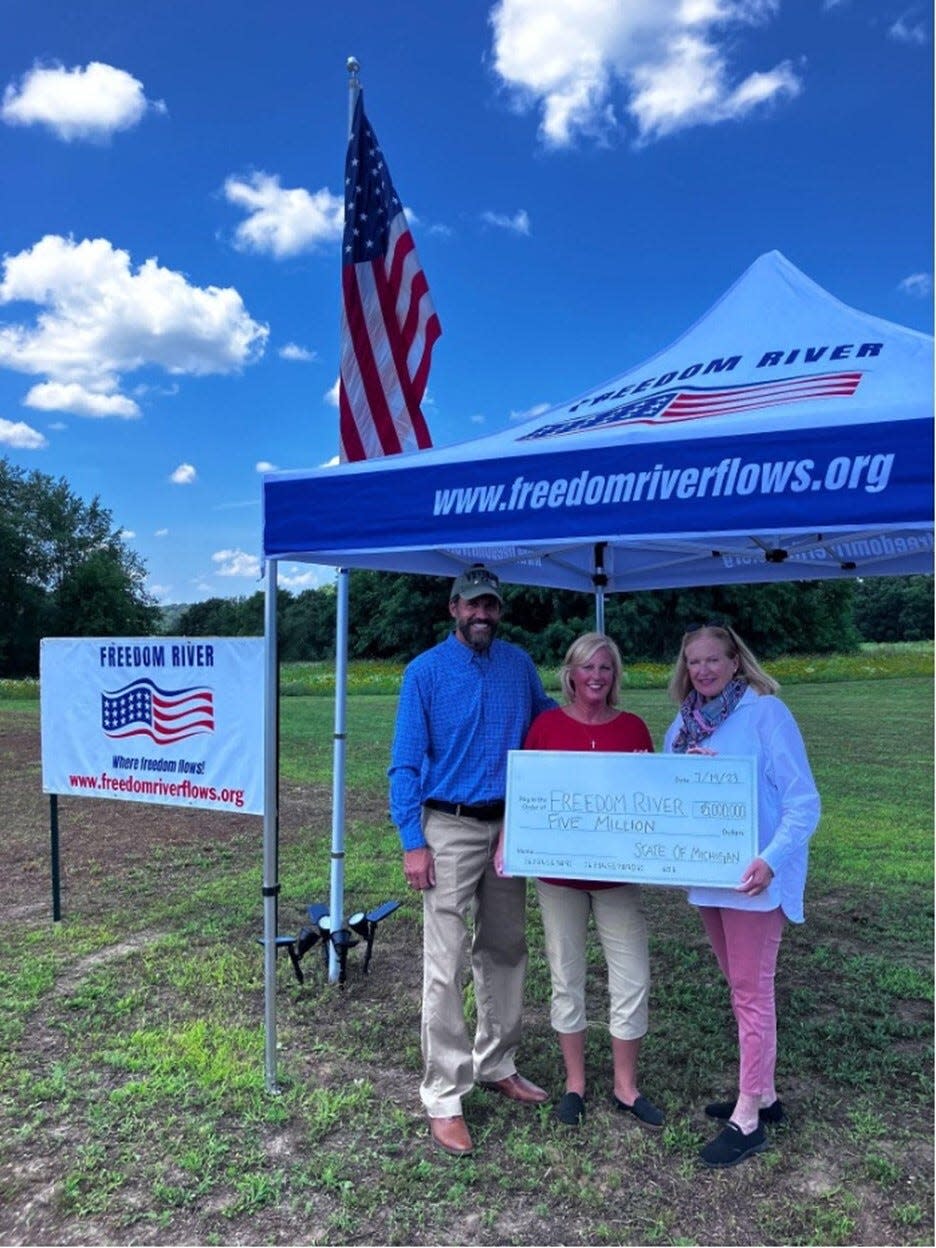Freedom River founders Jeff and Janna Yeakey accept $5 million in state funding from State Rep. Jennifer Conlin (D-Ann Arbor Township).