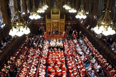 FILE PHOTO: Britain's Queen Elizabeth sits next to Prince Charles during the State Opening of Parliament in central London