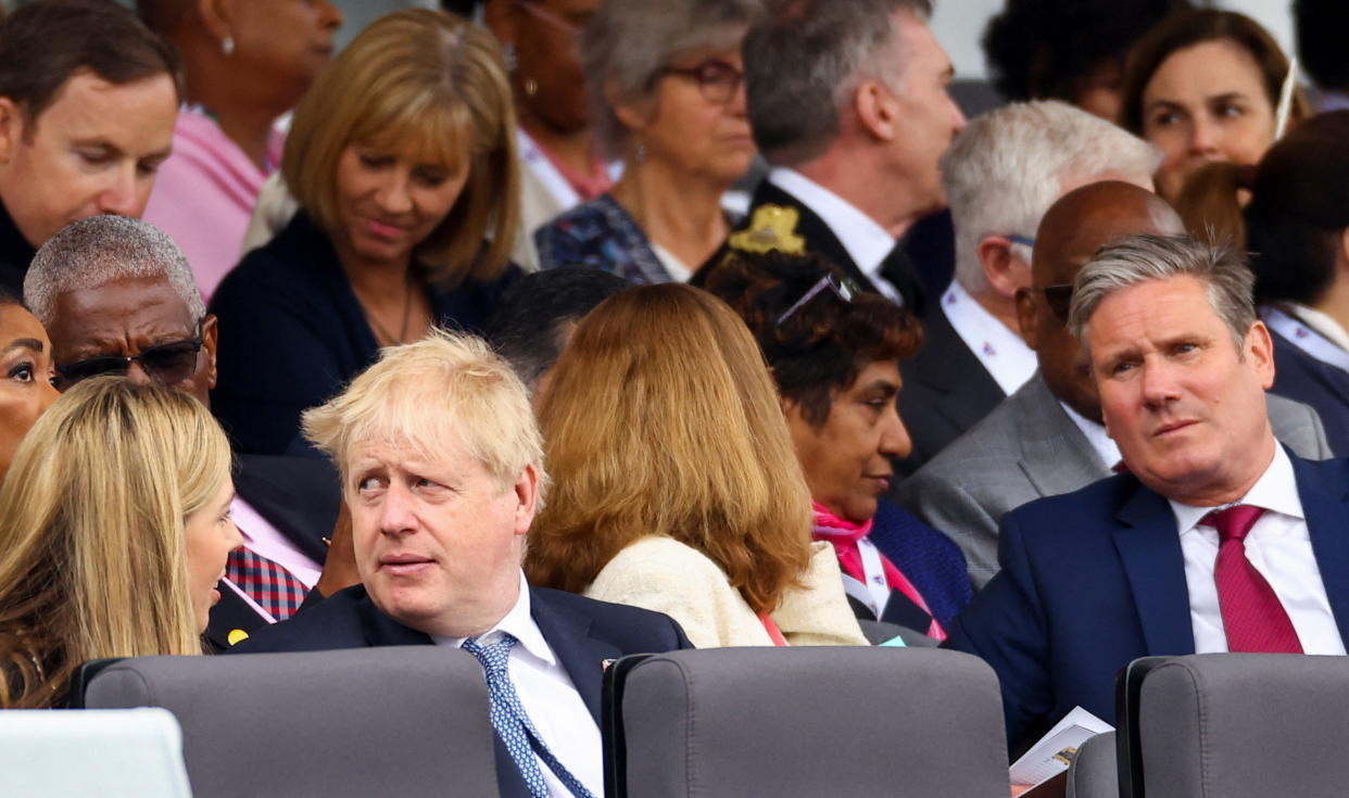 Prime Minister Boris Johnson, his wife Carrie Johnson and Labour Party leader Sir Keir Starmer during the Platinum Jubilee Pageant in front of Buckingham Palace, London, in June 