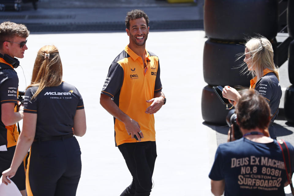 McLaren driver Daniel Ricciardo of Australia talks with team staff ahead of Sunday's Spanish Formula One Grand Prix at the Barcelona-Catalunya racetrack in Montmelo, just outside Barcelona, Spain, Thursday, May 19, 2022. (AP Photo/Joan Monfort)