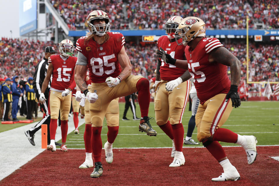 San Francisco 49ers tight end George Kittle (85) celebrates after scoring on a two point conversion during the second half of an NFL wild card playoff football game against the Seattle Seahawks in Santa Clara, Calif., Saturday, Jan. 14, 2023. (AP Photo/Jed Jacobsohn)