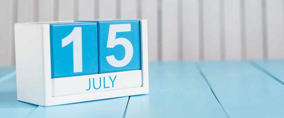 Image of july 15 wooden color calendar on white background.