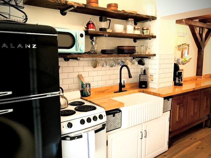 The kitchen area of a tiny home Airbnb in Trolley Square.