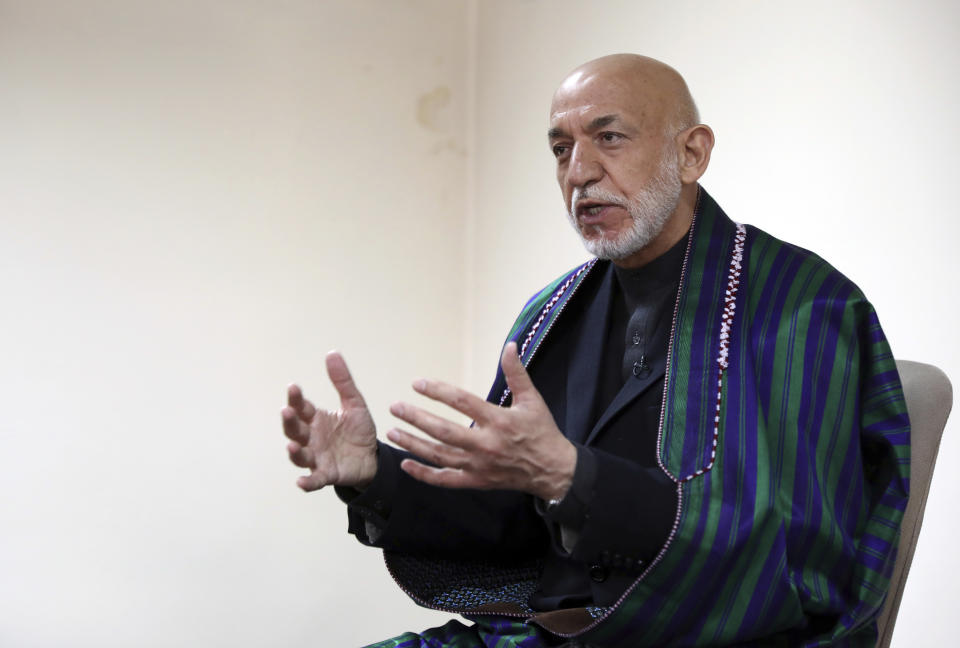 Former Afghan President Hamid Karzai speaks during an interview with the Associated Press in Kabul, Afghanistan, Thursday, March 11, 2021. Afghans are eager for peace and a recently floated U.S. draft for a deal between Taliban insurgents and the Afghan government is the best chance to accelerate stalled peace talks, ex-president Hamid Karzai said in an interview Thursday. (AP Photo/Rahmat Gul)
