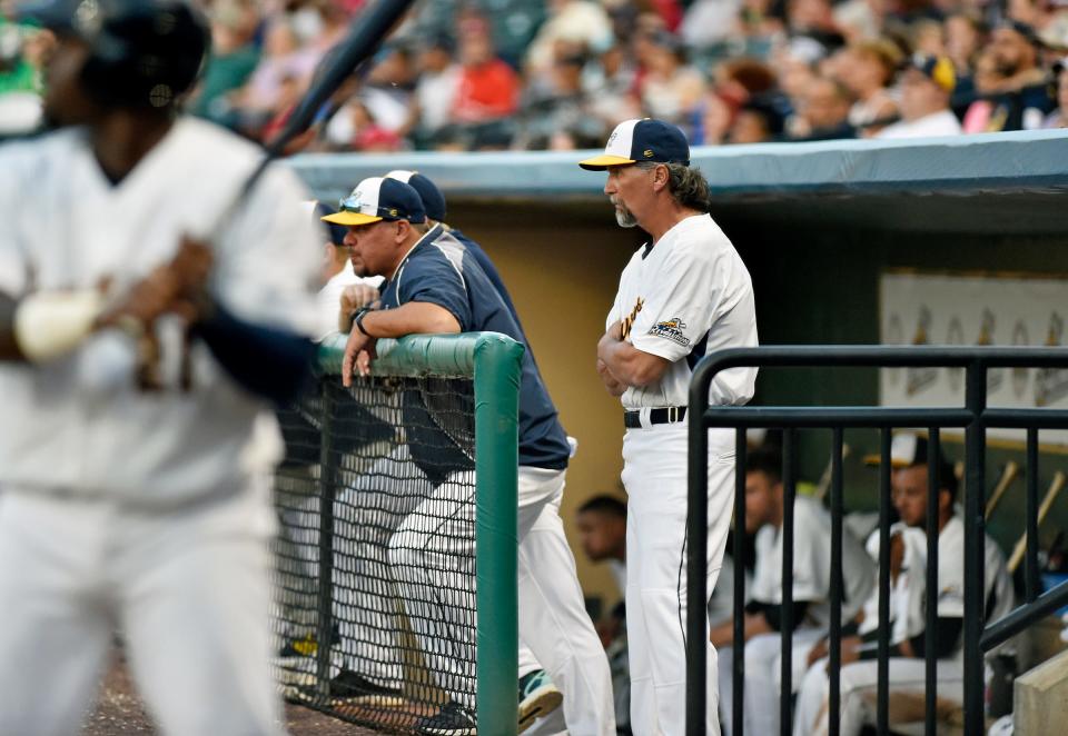 York Revolution manager Mark Mason watches from the dugout during team's first home game on April 28, 2017, at PeoplesBank Park in York, Pa.