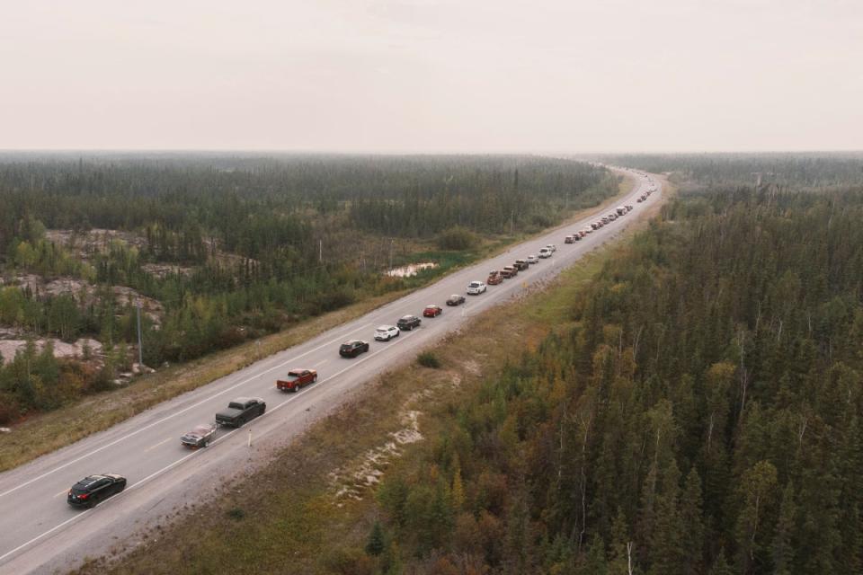 Yellowknife residents leave the city on Highway 3, the only highway in or out of the community, after an evacuation order was given due to the proximity of a wildfire in Yellowknife, Northwest Territories (REUTERS)