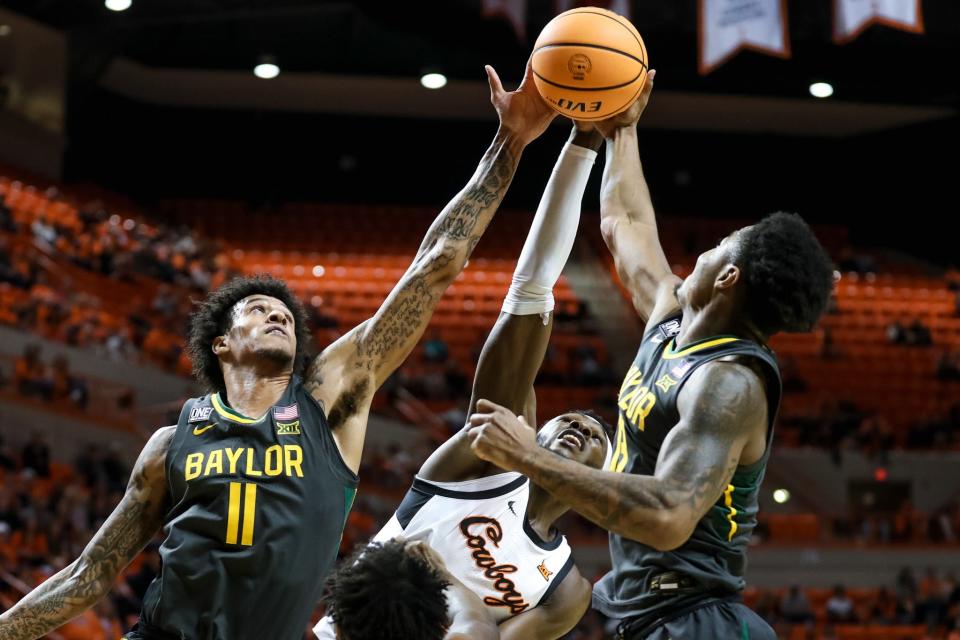 OSU's Moussa Cisse (33) fights for a rebound against Baylor's Jalen Bridges (11) and Baylor guard Langston Love (13) in the first half Monday at Gallagher-Iba Arena in Stillwater.