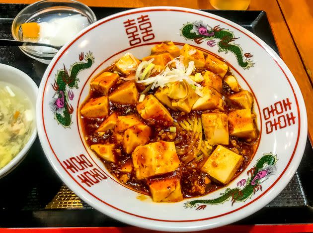 Mapo tofu is a spicy dish flavored with Sichuan peppercorns that make your mouth tingle. (Photo: DigiPub via Getty Images)
