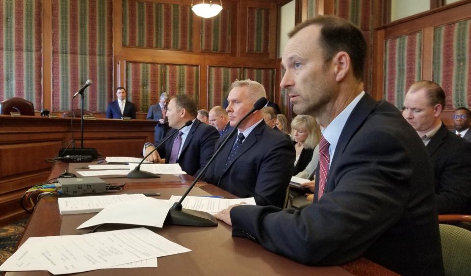 Bill DeWitt III, president of the St. Louis Cardinals, foreground, testifies in favor of sports wagering during a 2022 state Senate hearing alongside Todd George, executive vice president of Penn National Gaming, center, and Jeremy Kudon, president of the Sports Betting Alliance.