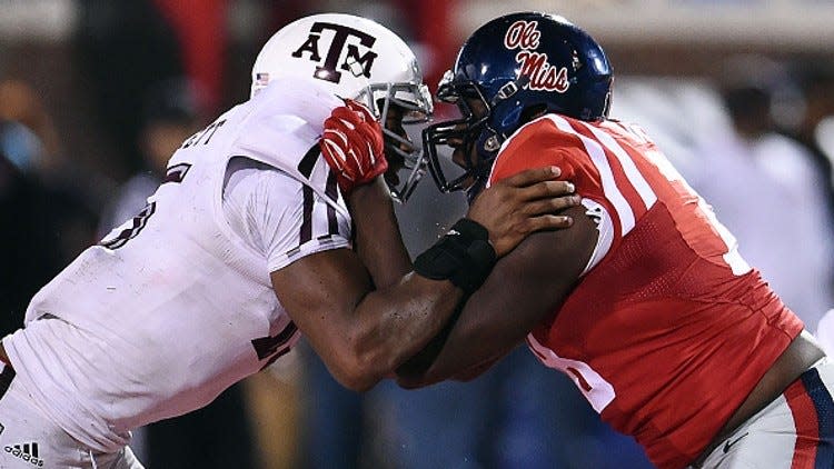 OXFORD, MS - OCTOBER 24: Myles Garrett #15 of the Texas A&M Aggies works against Laremy Tunsil #78 of the Mississippi Rebels during a game at Vaught-Hemingway Stadium on October 24, 2015 in Oxford, Mississippi. Mississippi defeated Texas A&M 23-3. (Photo by Stacy Revere/Getty Images)