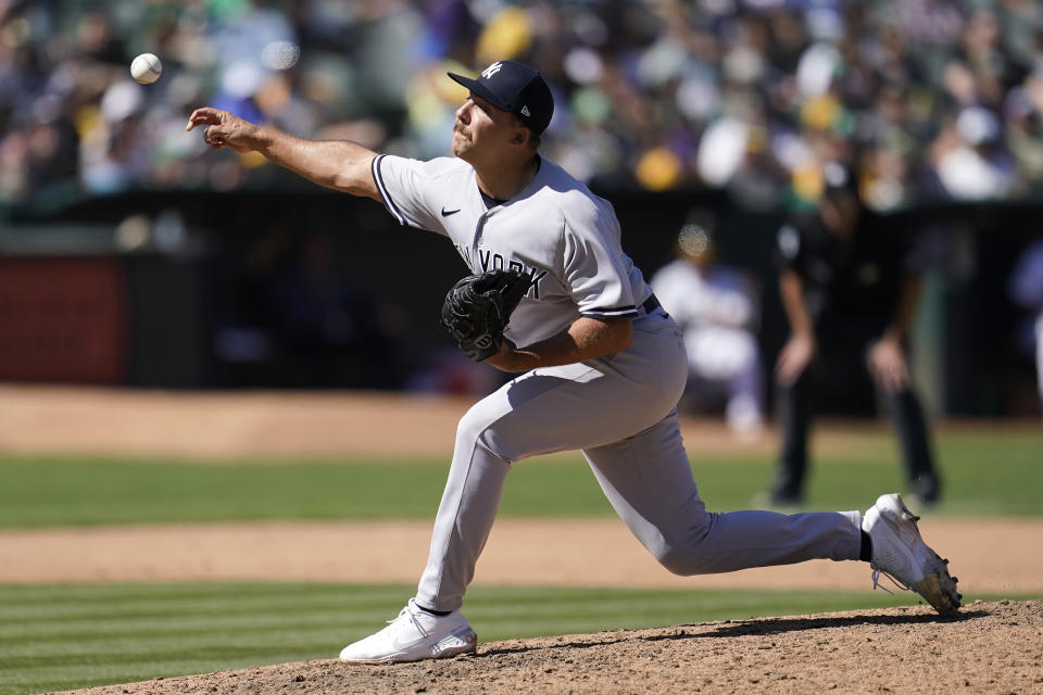 New York Yankees' Greg Weissert pitches against the Oakland Athletics during the sixth inning of a baseball game in Oakland, Calif., Sunday, Aug. 28, 2022. (AP Photo/Jeff Chiu)