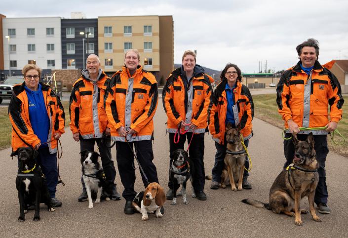 Members and their dogs of the Southern Ohio Canine Search and Rescue (SOCS) gather together on Jan. 20, 2023 in Chillicothe, Ohio. 