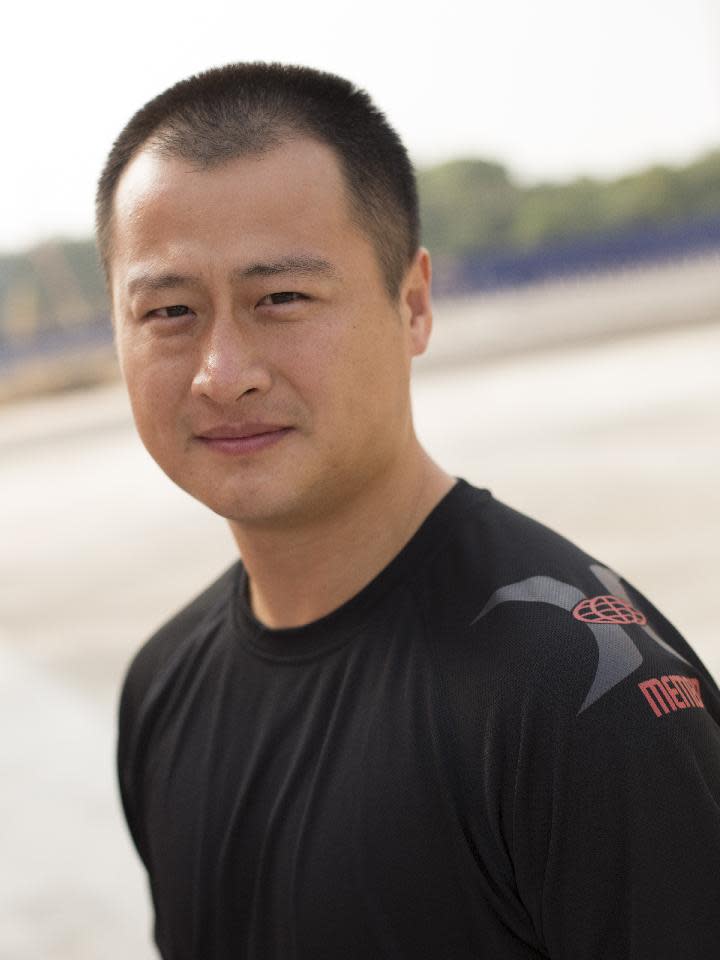 This undated photo provided by Brian Ho, shows stunt man Ju Kun on the back lot of the new Pinewood Studios in Johor Bahru, Malaysia. Ju Kun, whose credits include the acclaimed martial arts epic "The Grandmaster," was among the passengers on the Malaysia Airlines plane that disappeared early Saturday, March 8, 2014. Ju Kun was scheduled to work on the series pilot for “Marco Polo,” a joint Weinstein Co. and Netflix production, at the studio in Malaysia before he boarded the flight to return home to Beijing. (AP Photo/Brian Ho) NO SALES, NO ARCHIVES, MANDATORY CREDIT, ONE TIME USE ONLY