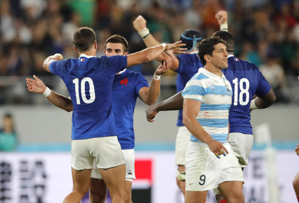 French players embrace after defeating Argentina 23-21 in the Rugby World Cup Pool C game at Tokyo Stadium between France and Argentina in Tokyo, Japan, Saturday, Sept. 21, 2019. (AP Photo/Christophe Ena)