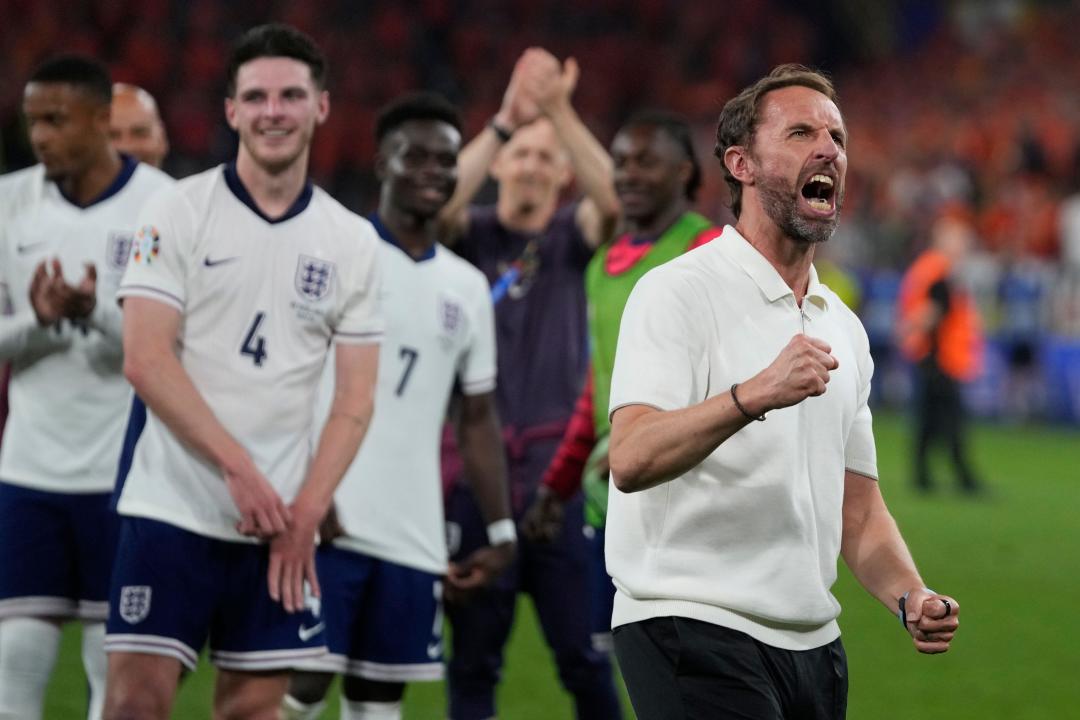England's manager Gareth Southgate celebrates at the end of a semifinal against Netherlands at the Euro 2024 soccer tournament in Dortmund, Germany, Wednesday, July 10, 2024. England won the game 2-1. (AP Photo/Thanassis Stavrakis)
