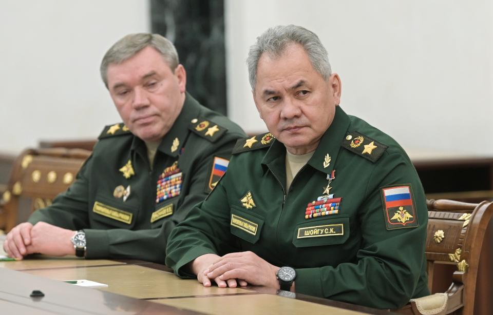 FILE - Russian Defense Minister Sergei Shoigu, right, and Head of the General Staff of the Armed Forces of Russia and First Deputy Defense Minister Valery Gerasimov listen to Russian President Vladimir Putin during their meeting in Moscow, Russia, on Feb. 27, 2022. Russia's military defeats in Ukraine along with the tensions fueled by an ill-planned mobilization and open rifts among the Kremlin insiders have left Putin increasingly cornered. (Alexei Nikolsky, Sputnik, Kremlin Pool Photo via AP, File)