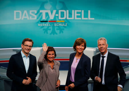 TV presenters Sandra Maischberger (ARD), Maybrit Illner (ZDF), Peter Kloeppel (RTL) and Claus Strunz (ProSieben/Sat.1) pose at the Adlershof TV studio to present the only TV debate of the German election between incumbent German Chancellor Angela Merkel and SPD candidate Martin Schulz collectively hosted by all German TV networks, in Berlin, Germany, September 1, 2017. REUTERS/Hannibal Hanschke